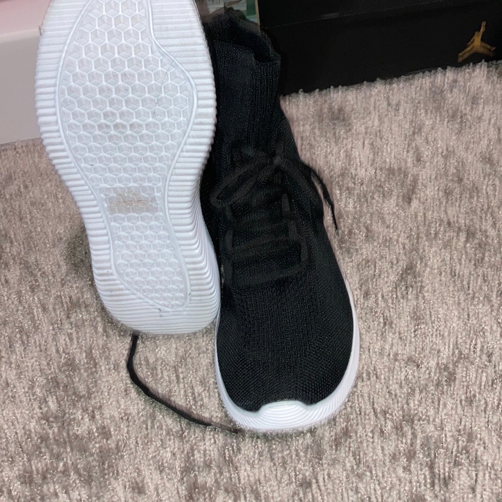 Woman’s black and white workout sneakers